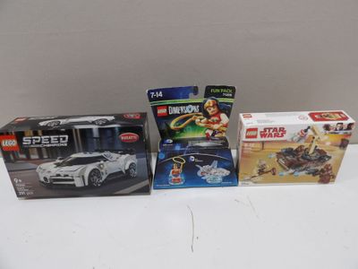 three lego cars are sitting next to each other on a table