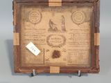 a picture of a small wooden box with a label on it