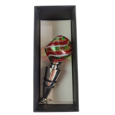 bottle stopper in a black box with a red and green swirl design