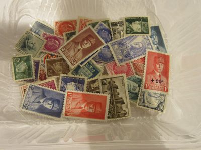many different stamps in a plastic container on the table