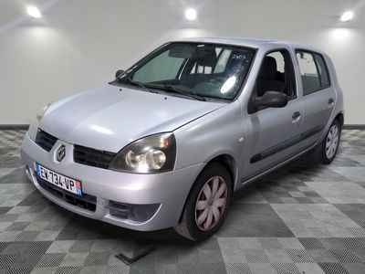 a silver car that is parked on a checkered floor