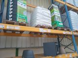 a shelf with a lot of items on it in a warehouse