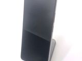 a cell phone that is sitting on top of a stand