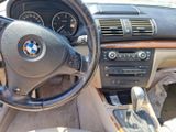 a steering wheel and dashboard of a bmw car