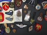 a lot of military patches and badges on a table