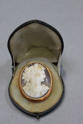 a small box with a picture of a woman inside of it