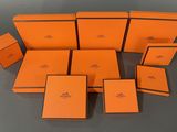 a group of orange boxes sitting on top of a table
