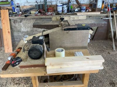 a workbench with tools on top of it in a workshop