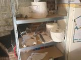 many rolls of toilet paper on the shelves in the room