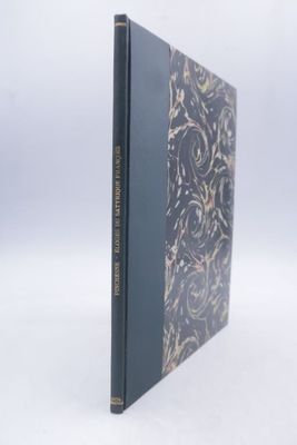 an old book with a black cover and gold writing on it
