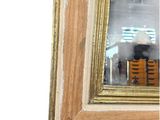 a reflection of a person in a mirror on the wall
