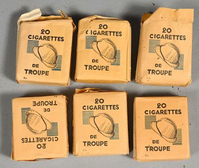 six boxes of cigarettes sitting on top of a table next to each other