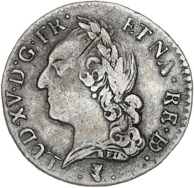 une pièce d'argent portant une tête de femme
