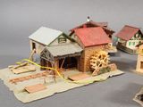 a lot of small model houses that are on the table