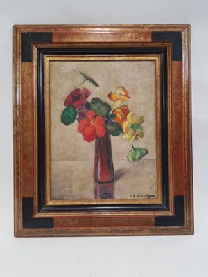 tableau représentant des fleurs dans un vase rouge accroché à un mur blanc