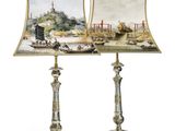 two lamps with pictures of boats on them sitting on top of a table