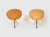 pair of wall lights in the shape of a fan