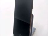 a cell phone that is sitting on a stand
