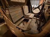 a seat in the back of a military vehicle
