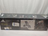 boxed box of adidas hit deck tennis equipment on a white background