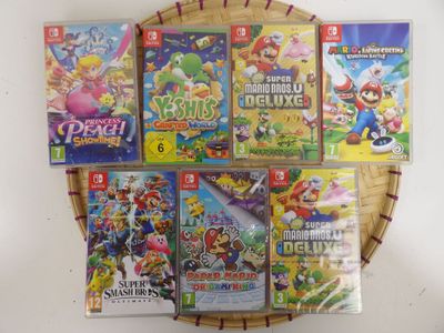 beaucoup de jeux de nintendo wii sur la table