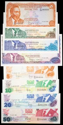 four different bills of different colors and shapes on a black background