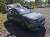 a picture of a grey car parked in a parking lot