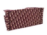 purple and beige clutch bag with elephant print on the front