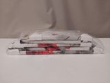 three bags of pizza sitting on top of a white table