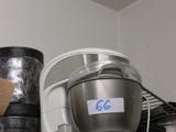 a metal bucket on a shelf in a room