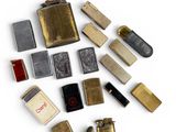 many different types of lighters and lighters on the table
