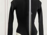 an image of a black bodysuit on a mannequin