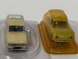 three toy cars that are sitting on top of each other
