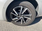 a close up of a tire on a white car