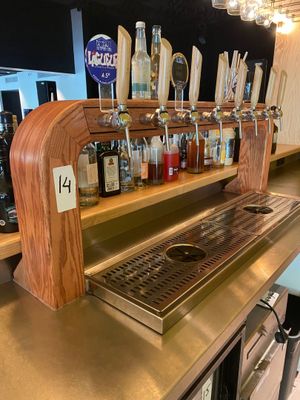 a bar with a lot of bottles on the counter