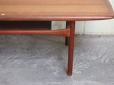 a small wooden table with a drawer underneath it
