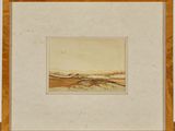 a painting of a landscape in a frame on a table