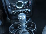 a close up of a car ' s interior with a steering control