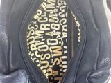 the inside of a black purse with a zipper on it