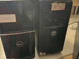 two computers sitting on top of each other on a table