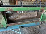 a machine that has a large metal object on it