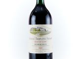 a bottle of wine that is sitting on a table