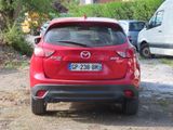 a red car that is parked on the side of the road