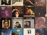 a lot of records on the wall of a room