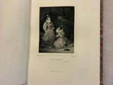 an open book with a picture of a woman and a child in it