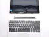 a laptop and a tablet on a white table