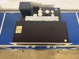 a machine that is sitting on top of a blue table