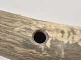 a piece of wood that has a hole in it