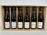 six bottles of wine in a wooden box on a white background