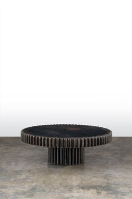 an image of a black and white photo of a table with gears